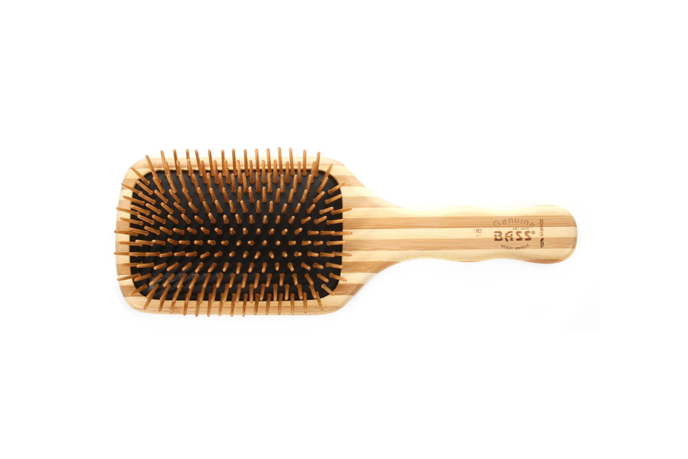 Bass The Green Brush side view highlights the large paddle for comfortable brushing and even oil distribution.