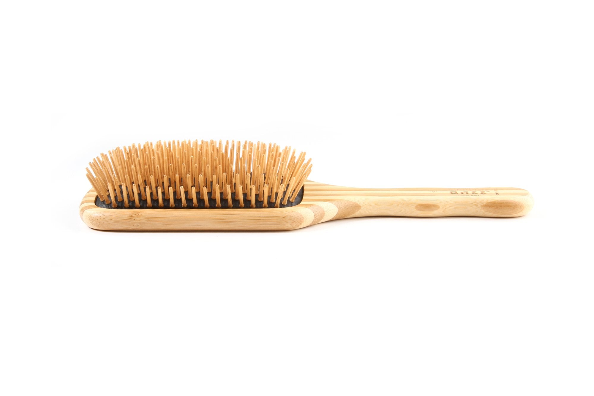 Bass The Green Brush closeup reveals wood bristles for reduced static and a soothing scalp massage.