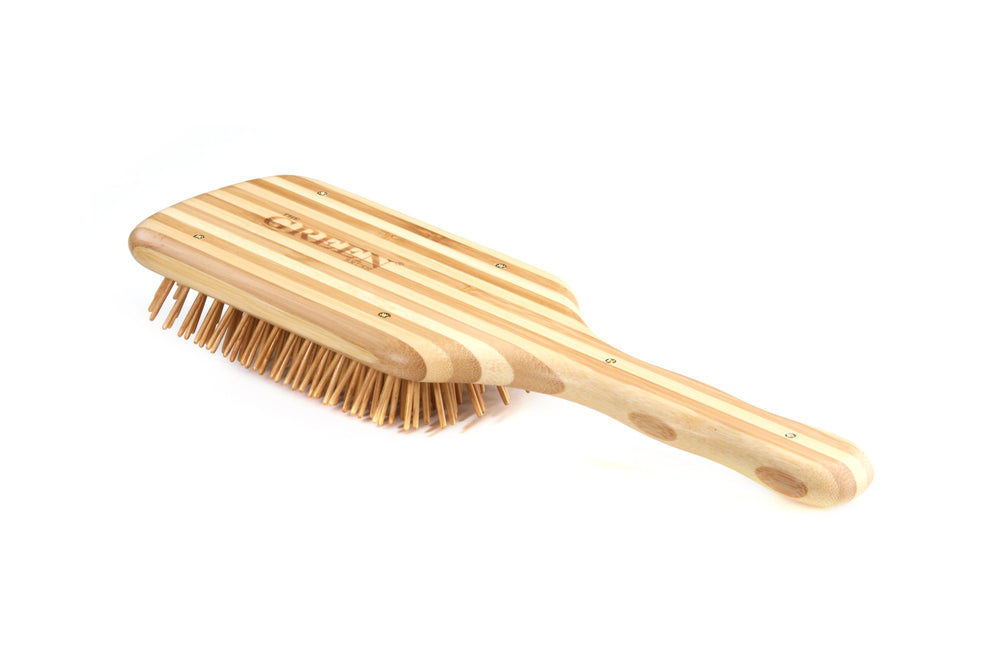 Bass The Green Brush large paddle in use supports styling and smoother blow-drying with bamboo bristles.