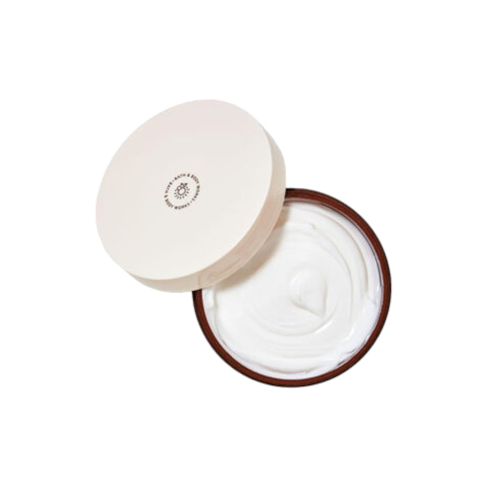 Bath & Body Works body butter application shows shimmering finish for radiant skin.