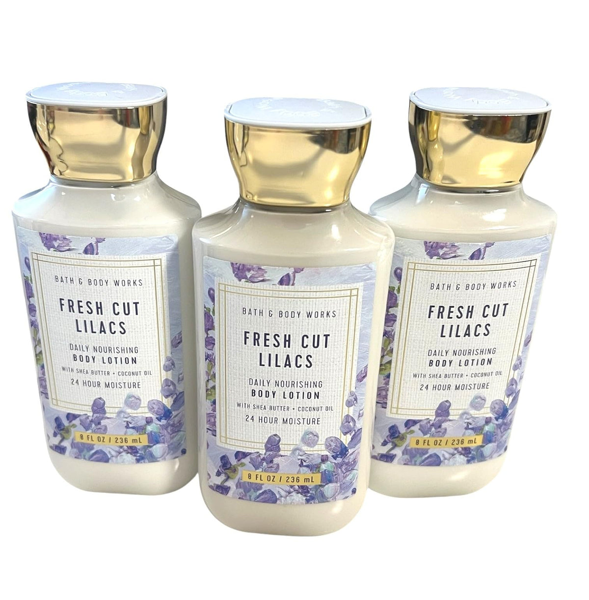 Bath and Body Works Fresh Cut Lilacs 3 Pack bottles closeup for daily moisturizing.
