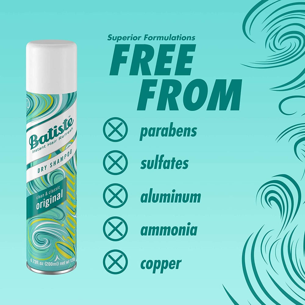 Batiste dry shampoo spray application for instant root refresh.
