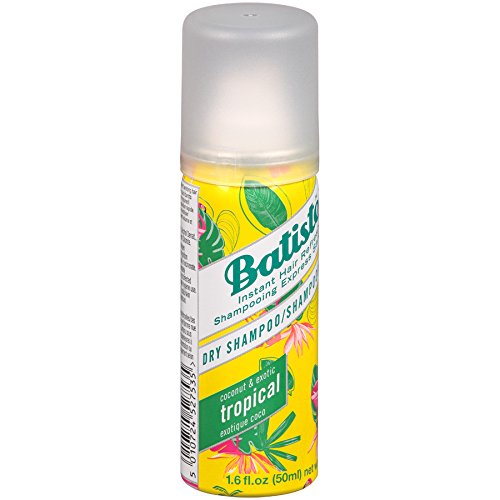 Batiste Tropical dry shampoo application; quick spray for day-long oil control.