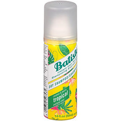 Batiste Tropical dry shampoo application; quick spray for day-long oil control.