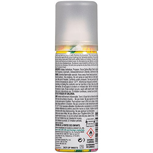 Batiste Tropical dry shampoo pack in hand; lift and texture in a pinch.