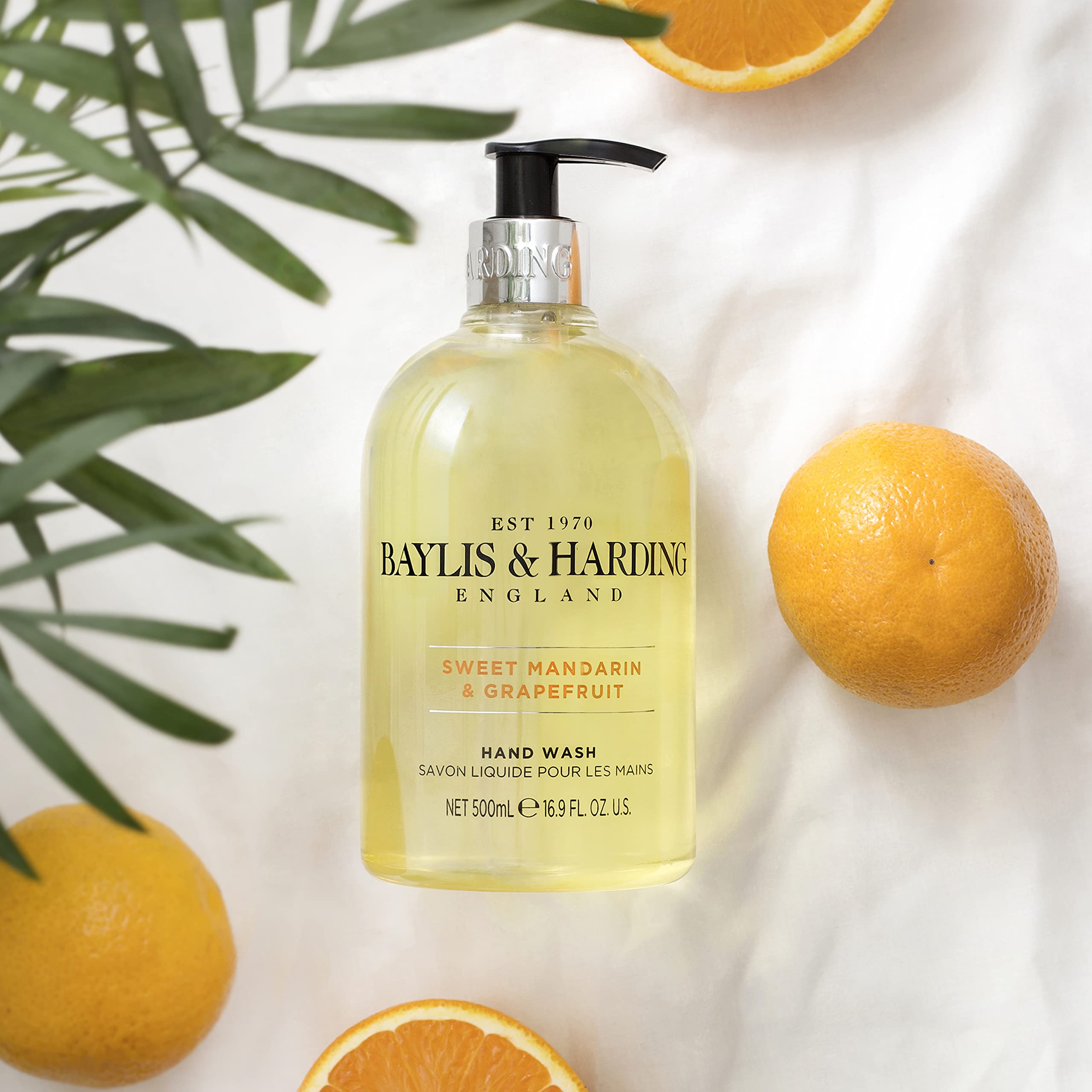 Three-pack display of Baylis & Harding hand soap in a luxurious kitchen or bathroom setup