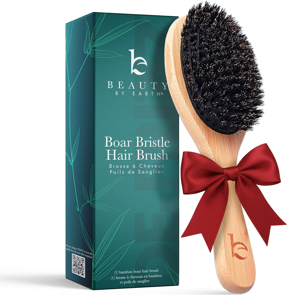 Beauty by Earth boar-bristle brush closeup shows soft bristles for gentle detangling.