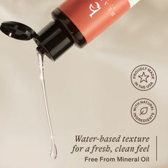 Beauty by Earth makeup remover bottle beside organic ingredients highlights clean beauty ethics.