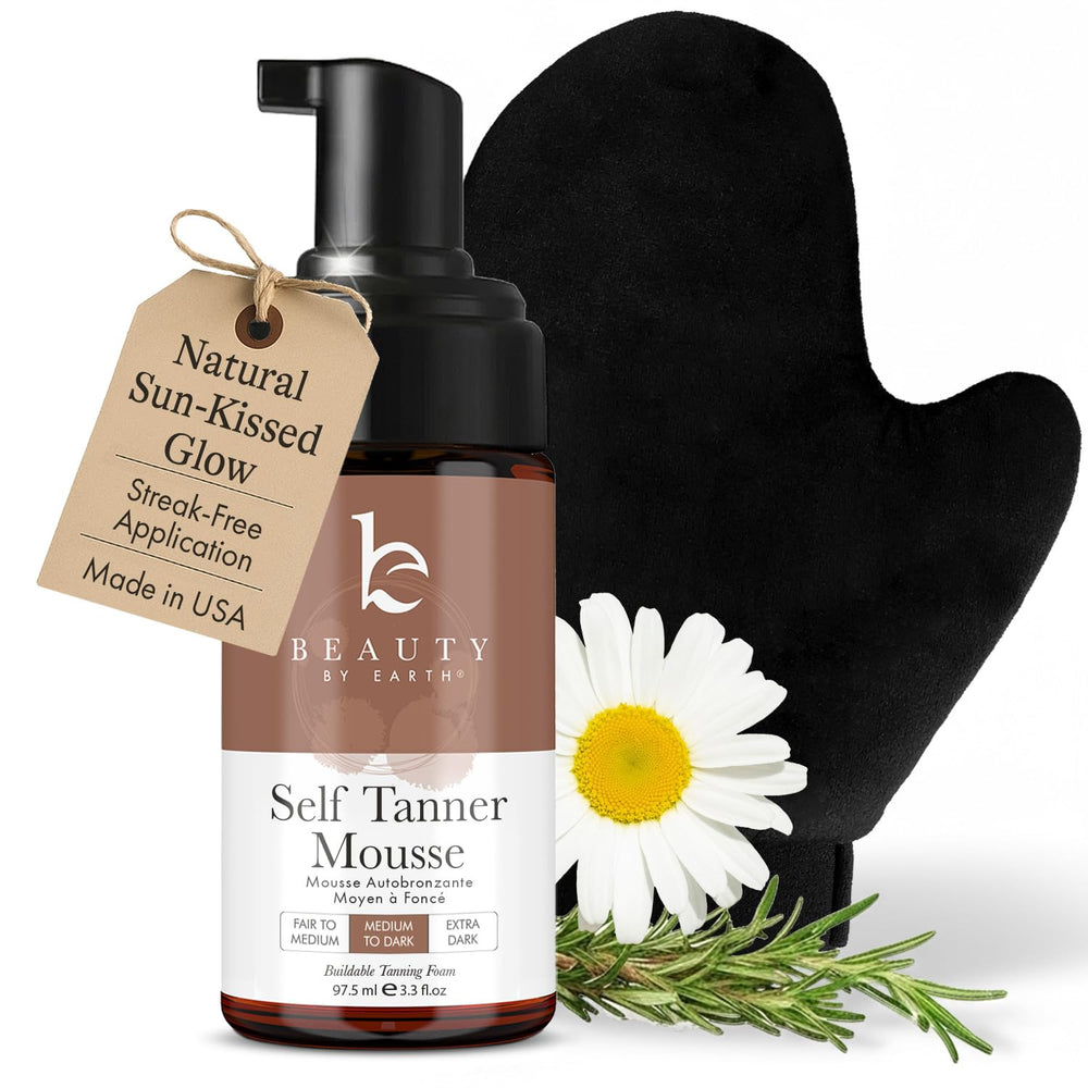 Beauty by Earth self-tanner mousse bottle ready to apply for a natural, sunless glow.
