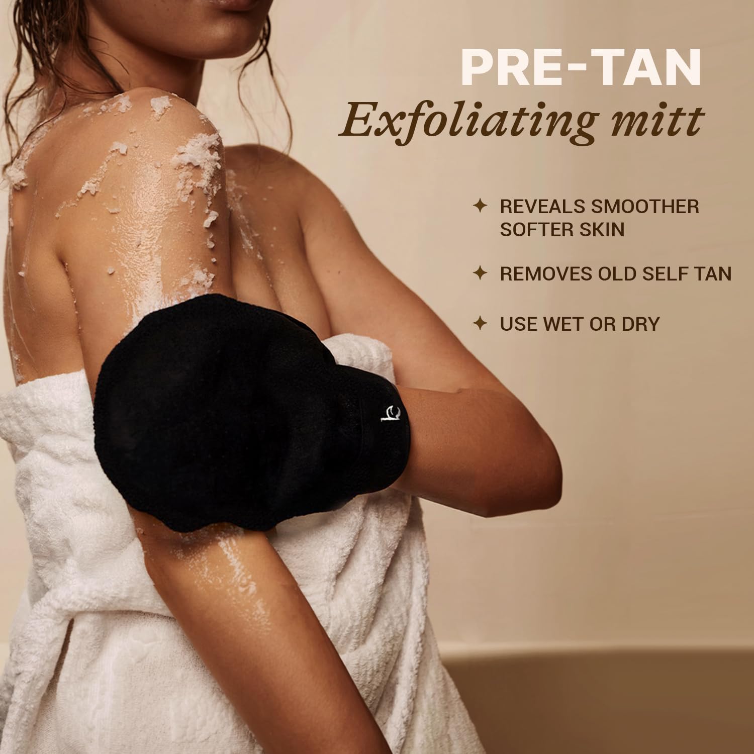 Beauty by Earth hands using mitts to apply self tan.