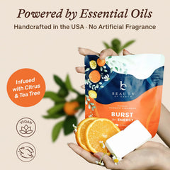 Beauty by Earth citrus shower steamer tablet dissolving in warm water releases scent.