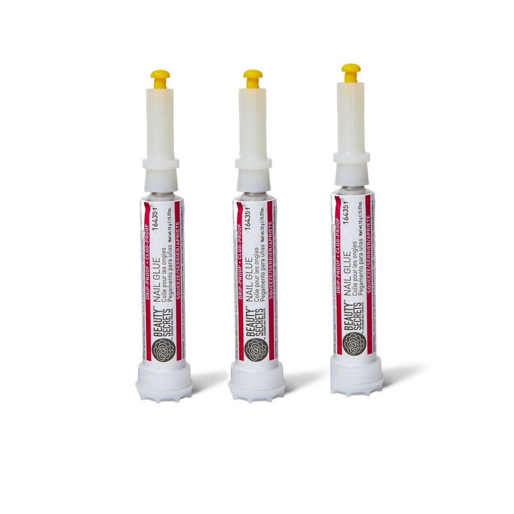 Beauty Secrets nail glue bottle closeup shows precision bonding for flawless manicures.