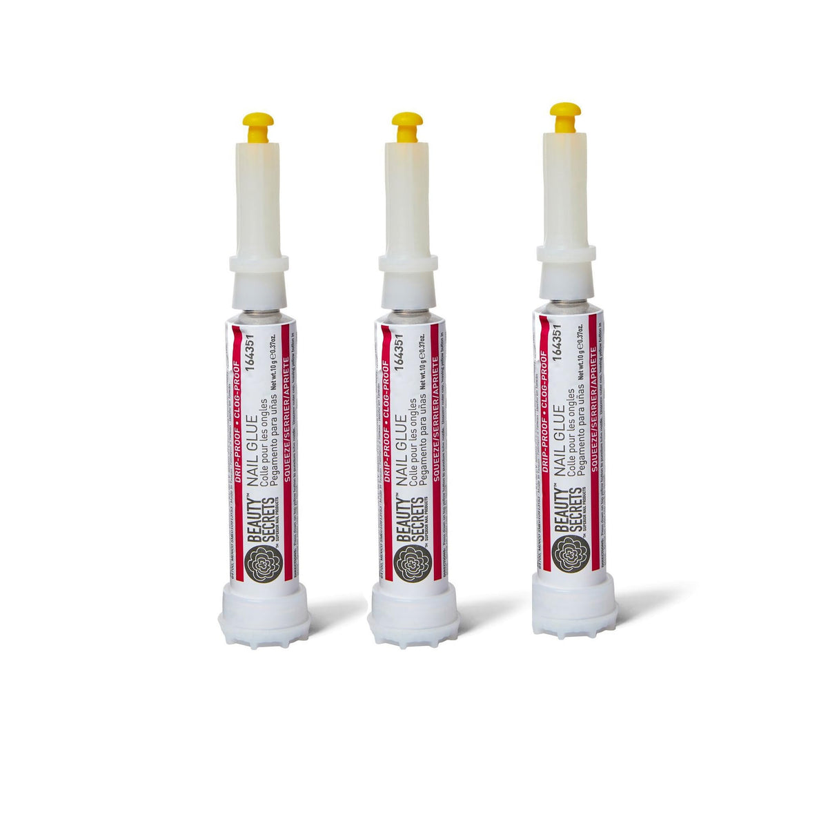 Beauty Secrets nail glue bottle closeup shows precision bonding for flawless manicures.