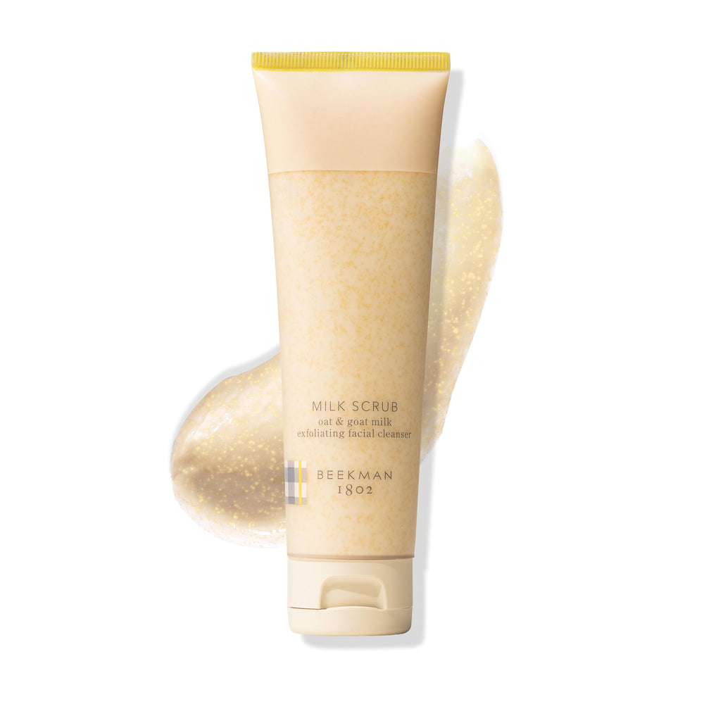 Beekman 1802 oat goat milk exfoliating scrub jar close-up, fragrance-free packaging for sensitive skin.