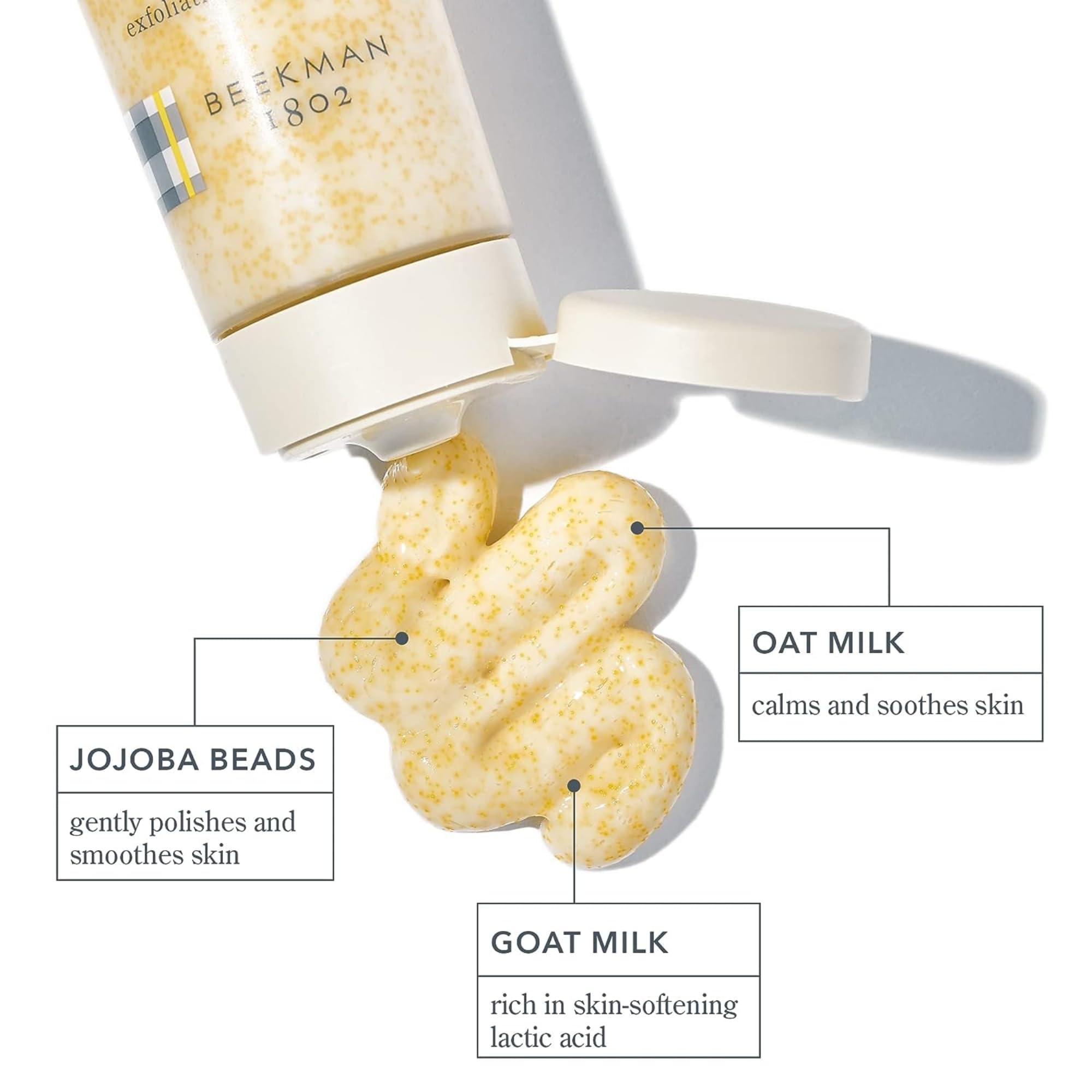 Beekman 1802 exfoliating scrub texture close-up highlighting jojoba beads for gentle polishing.