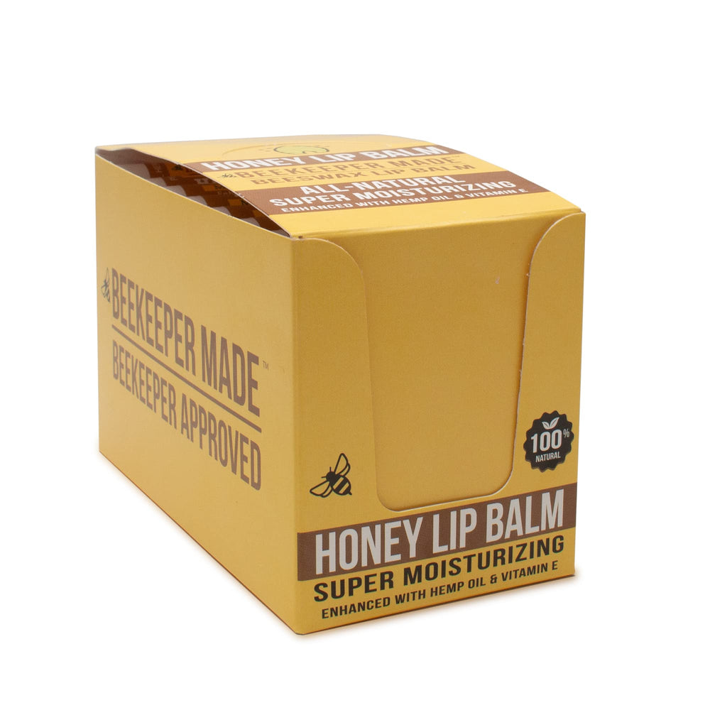 Beessential Beekeeper lip balm on lips shows smooth hydration and honey flavor