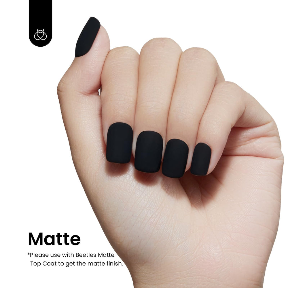Beetles Black Winter Gel Polish application in progress demonstrates smooth coverage.
