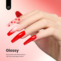 Beetles Christmas Red gel polish swatch on nail reveals vibrant holiday shade.