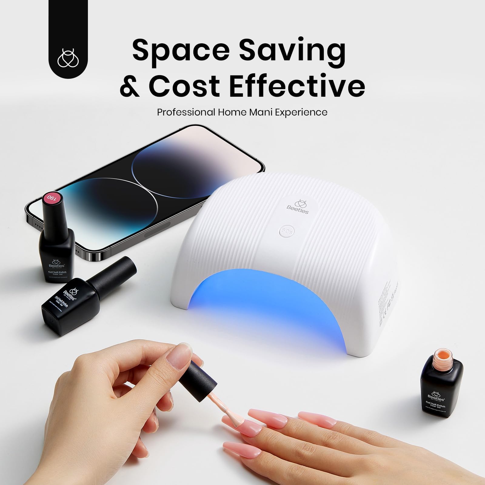 Beetles Gel Polish UV LED Nail Lamp packaged with power cable and manual.