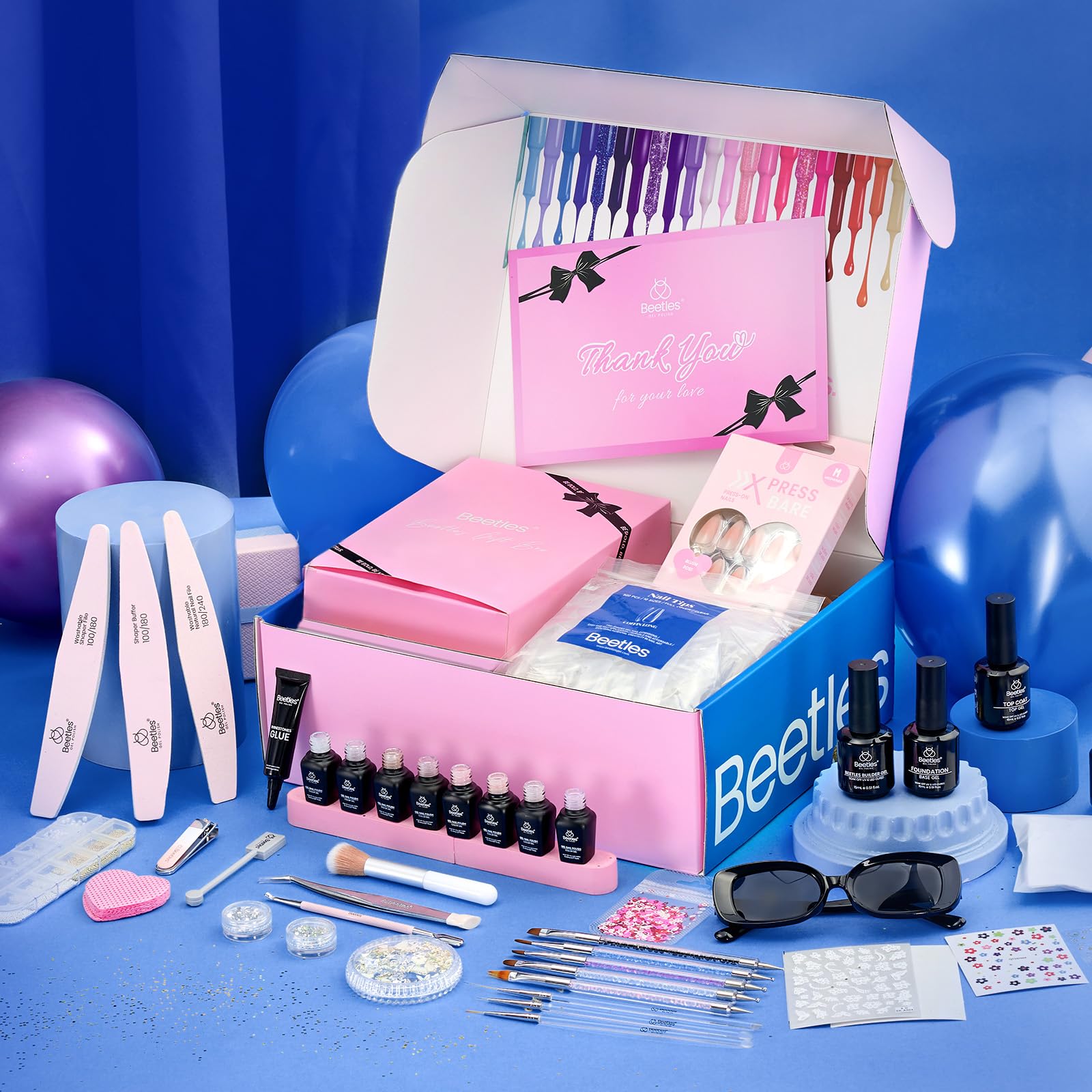 Beetles gift box with sunglasses and nail tips adds value for gifting.