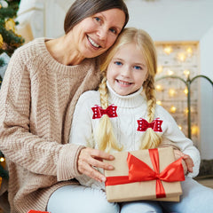 Beleki handcrafted candy cane bow clip with glitter accents