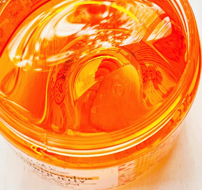 Bella & Bear Fizzy Clementine Shower Jelly amber bottle on shelf signals refreshing morning routine.