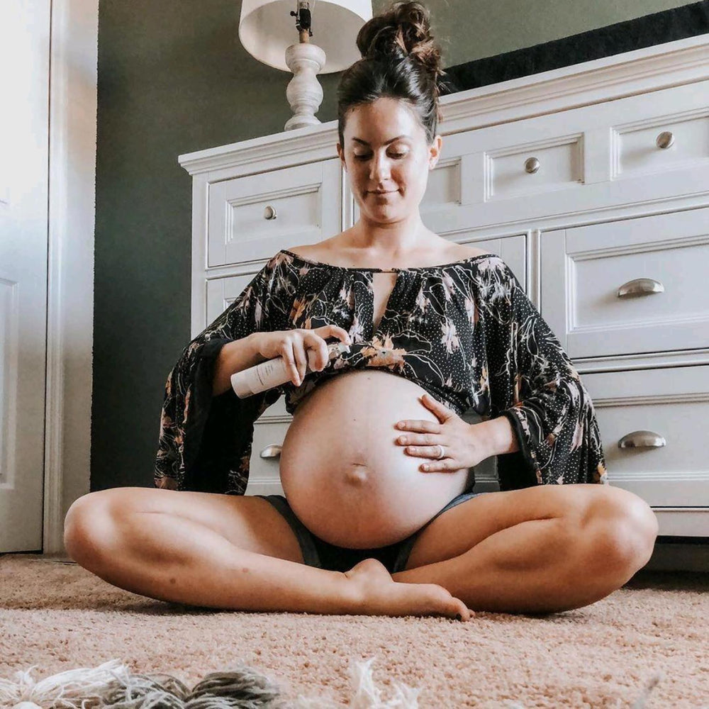 Belli stretch mark oil application on stomach showing nurturing routine.