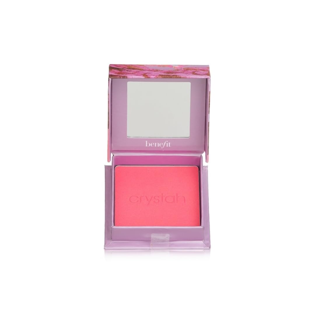 Benefit model applying blush with a cheek brush demonstrating natural luminous cheek benefit