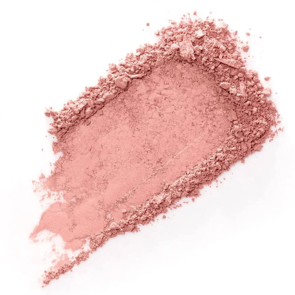 Benefit open pan close-up revealing silky baby-pink powder texture