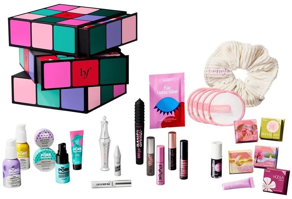 Benefit open contents flatlay with visible mascaras, tints, primers showing travel-ready variety
