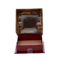 Benefit compact with mirror beside coin for scale and convenient on-the-go benefit