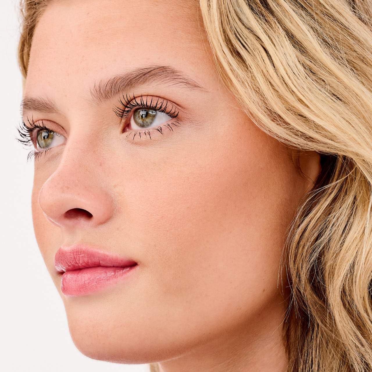 Benefit Hoola bronzer being applied with brush demonstrating easy blending benefit