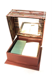 Benefit Hoola Toasted Deep applied on model cheek demonstrating natural matte contour