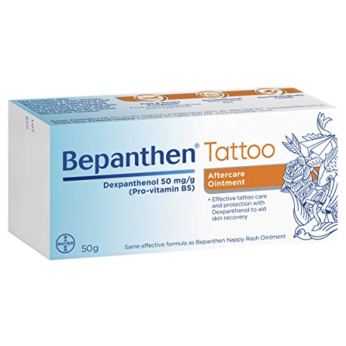 Bepanthen Tattoo Aftercare Ointment being applied to soothe post-tattoo areas
