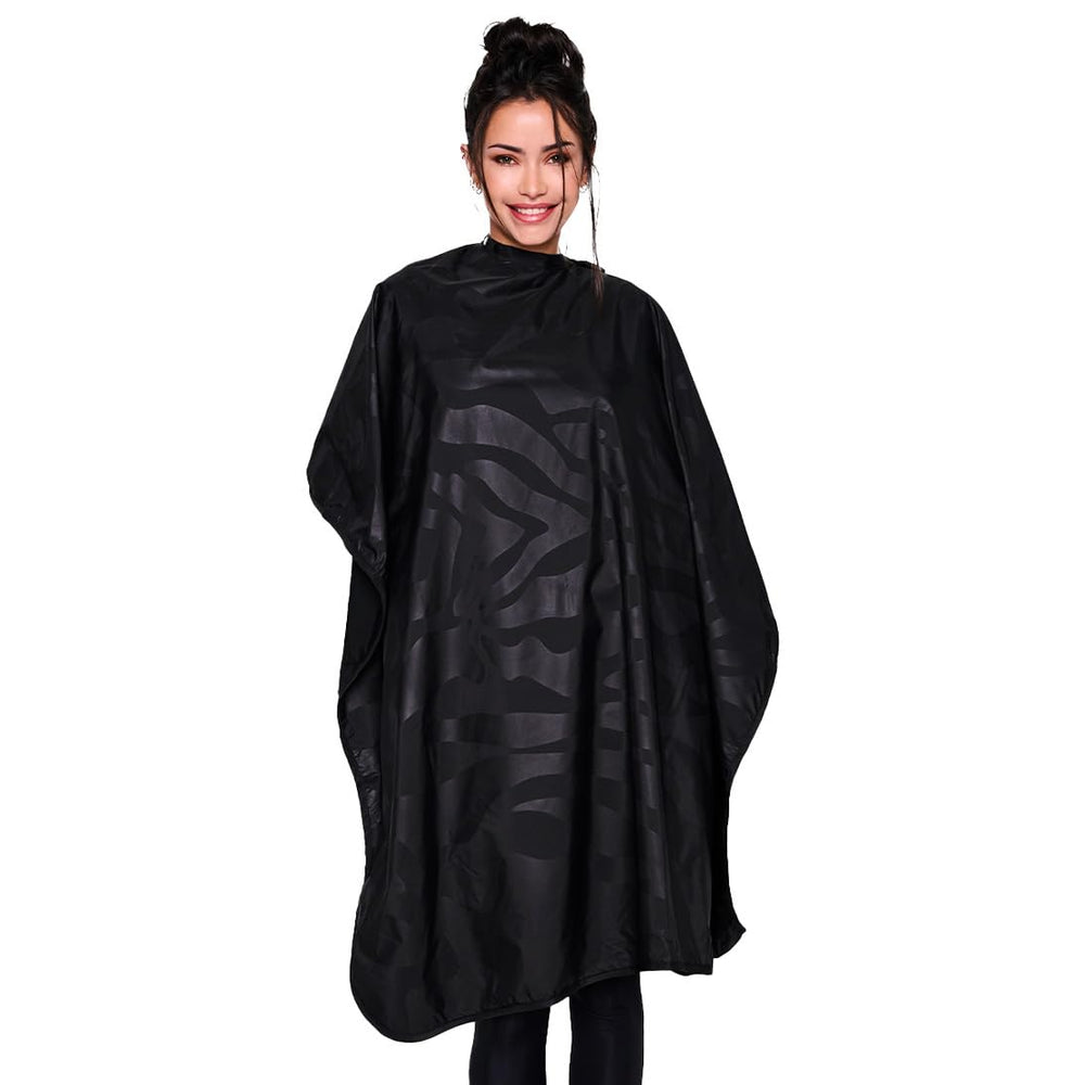 Betty Dain bleach-proof cape folded for storage, ready for quick salon setup.