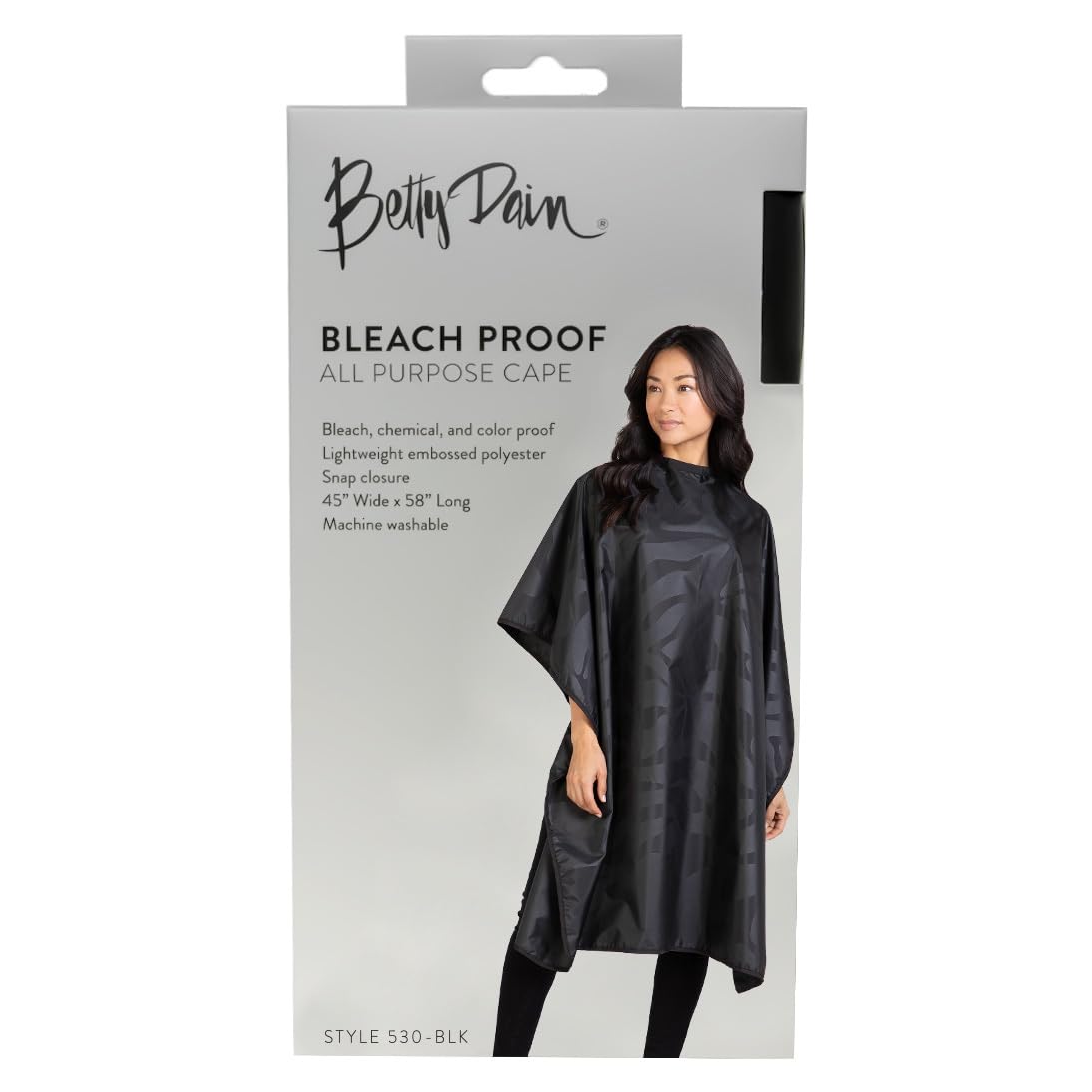 Betty Dain machine-washable cape hanging, pristine after use.