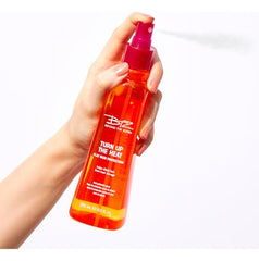 Beyond The Zone Turn Up The Heat Protection Spray spray-on application on damp hair for even slip.
