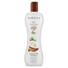BioSilk Silk Therapy Coconut Oil Moisturizing Shampoo bottle close-up promotes moisture and shine.