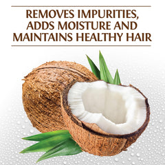 BioSilk Silk Therapy Coconut Oil Moisturizing Shampoo poured into palm for smoothing hydration.