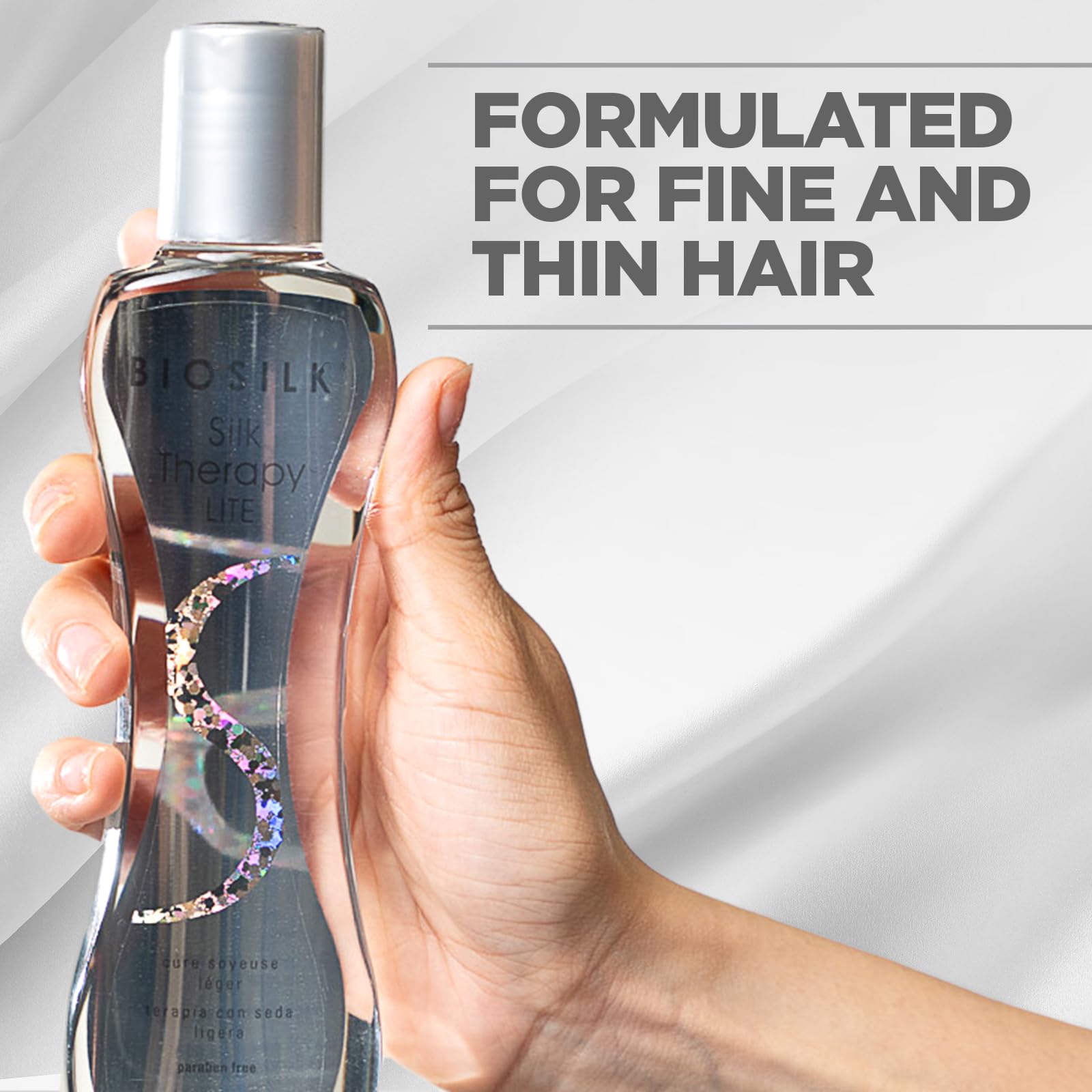 BioSilk Silk Therapy Lite being applied to hair ends for frizz resistance and smoothness