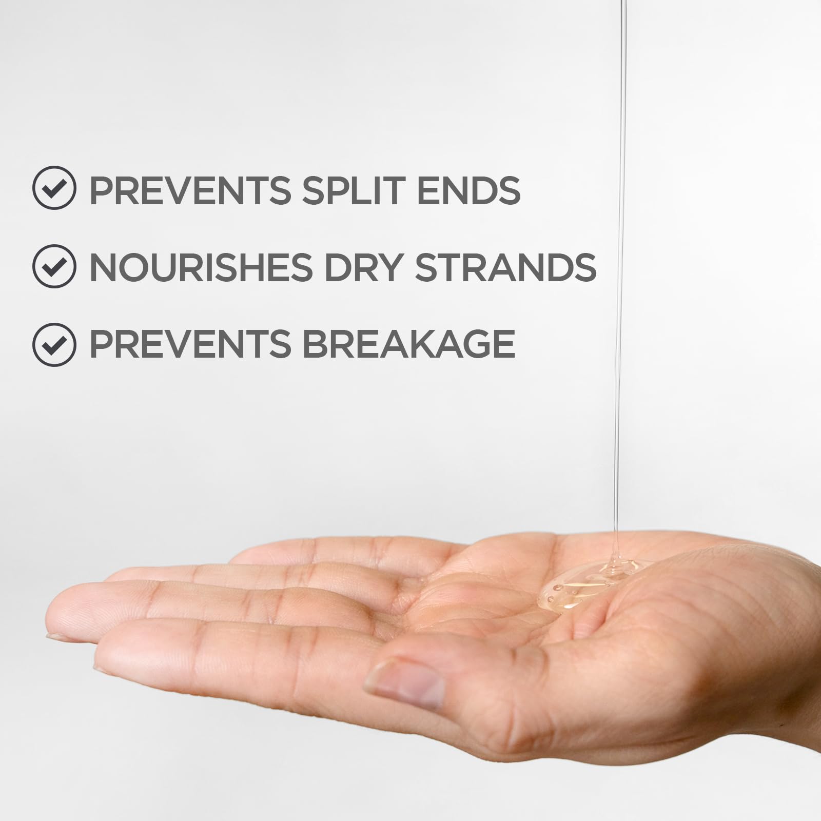 BioSilk Silk Therapy Original leave-in palm application demonstrates weightless smoothing.