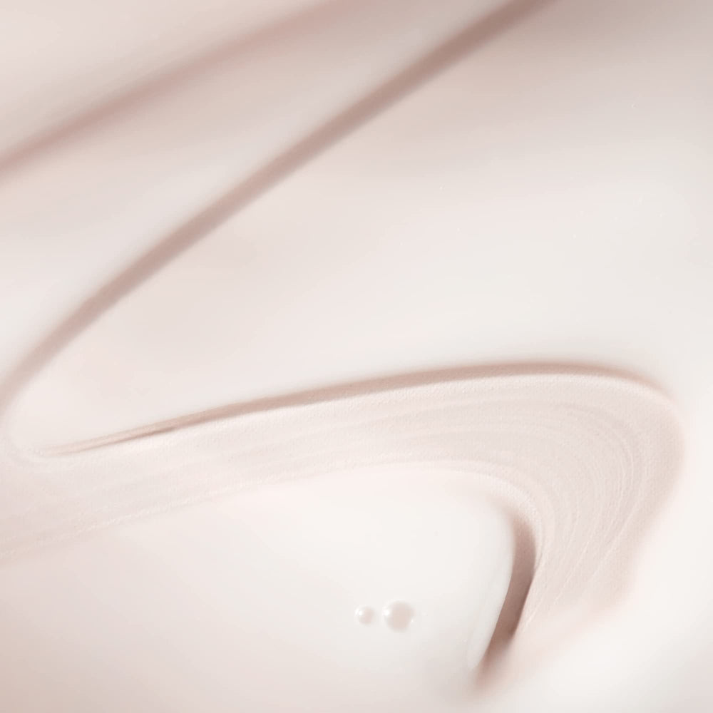 BIOSSANCE close-up-face-application shows fast-absorbing serum layering under moisturizer