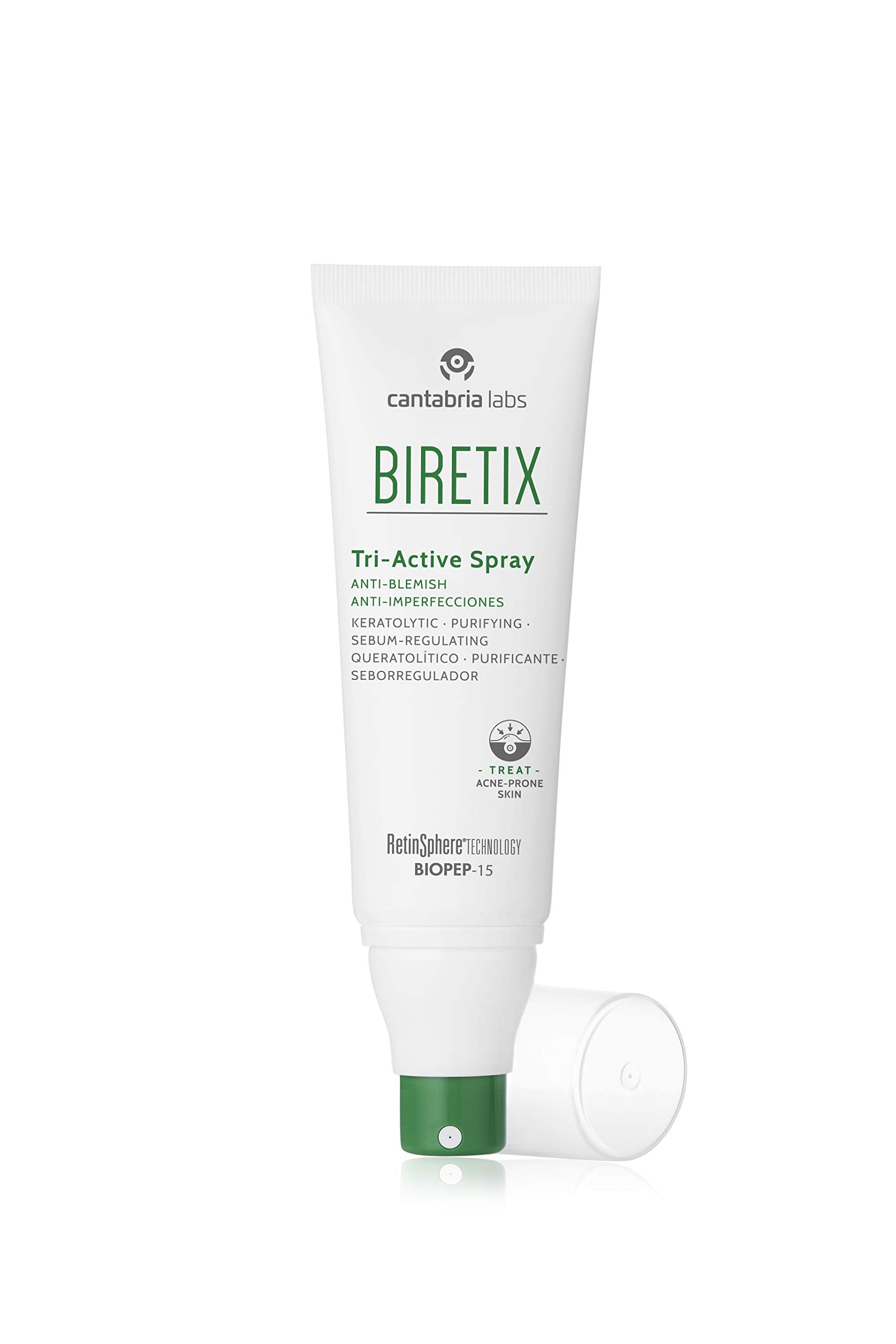 Biretix Tri-Active Spray in hand, portable daily skin care solution.