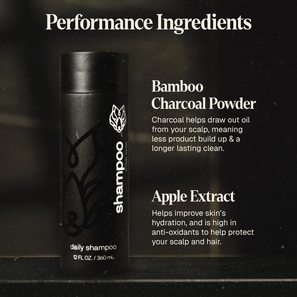 Black Wolf conditioner smooths hands illustrating detangling and silky texture.