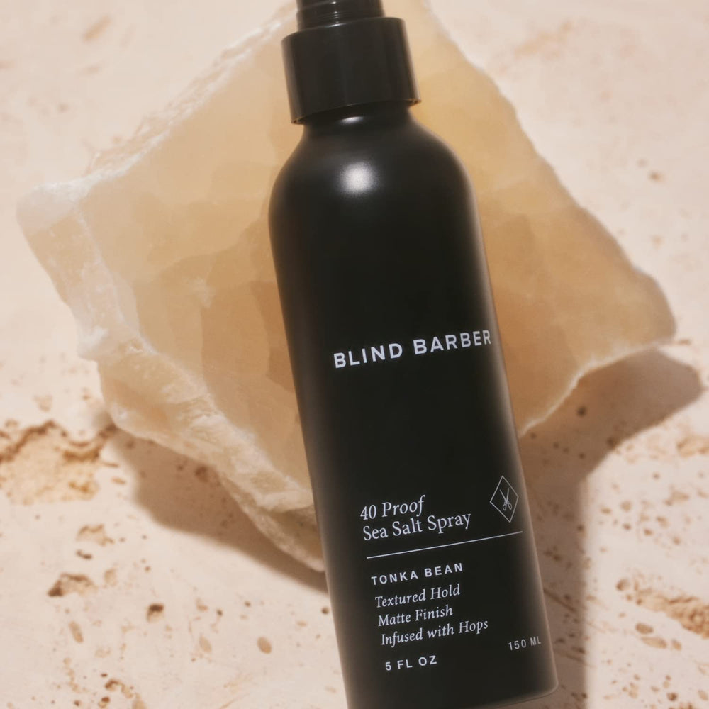 Blind Barber damp-hair application shows spray from roots to ends