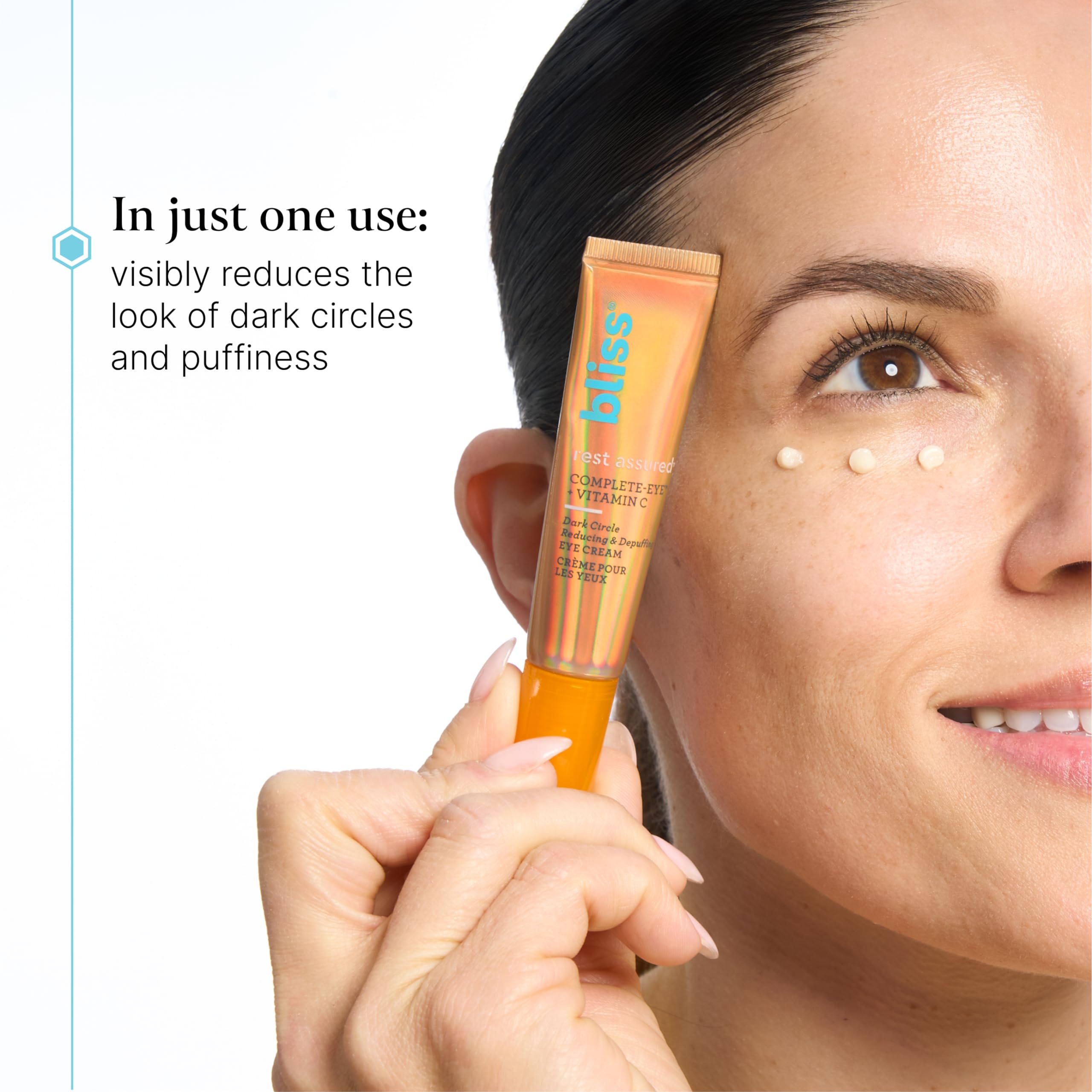 Bliss Rest Assured Eye Cream being applied with ring finger for gentle use.