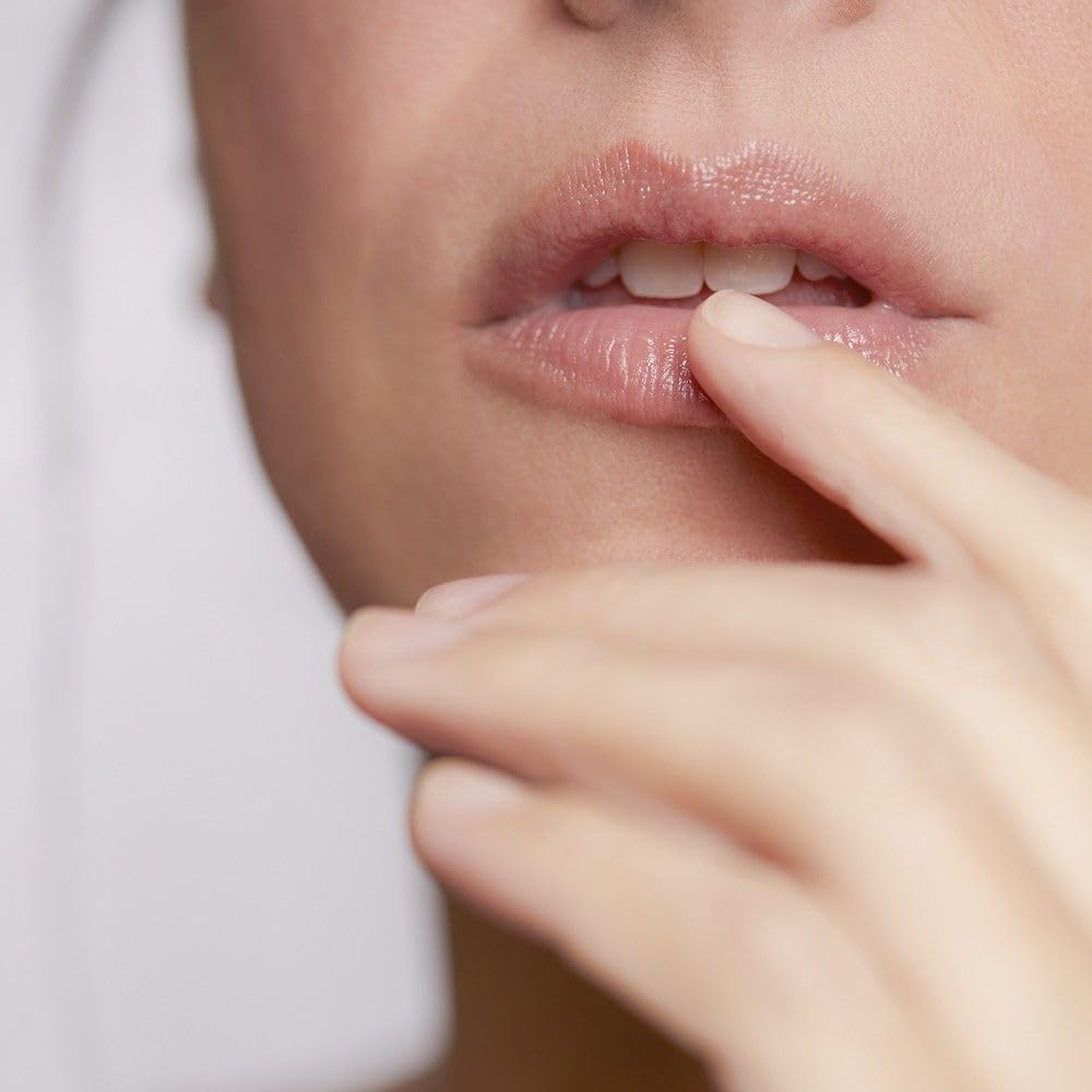 Blue Lagoon microalgae bioactive powder visual highlights nourishing lip care.