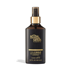Bondi Sands Liquid Gold bottle closeup with spray nozzle for mess-free tanning.