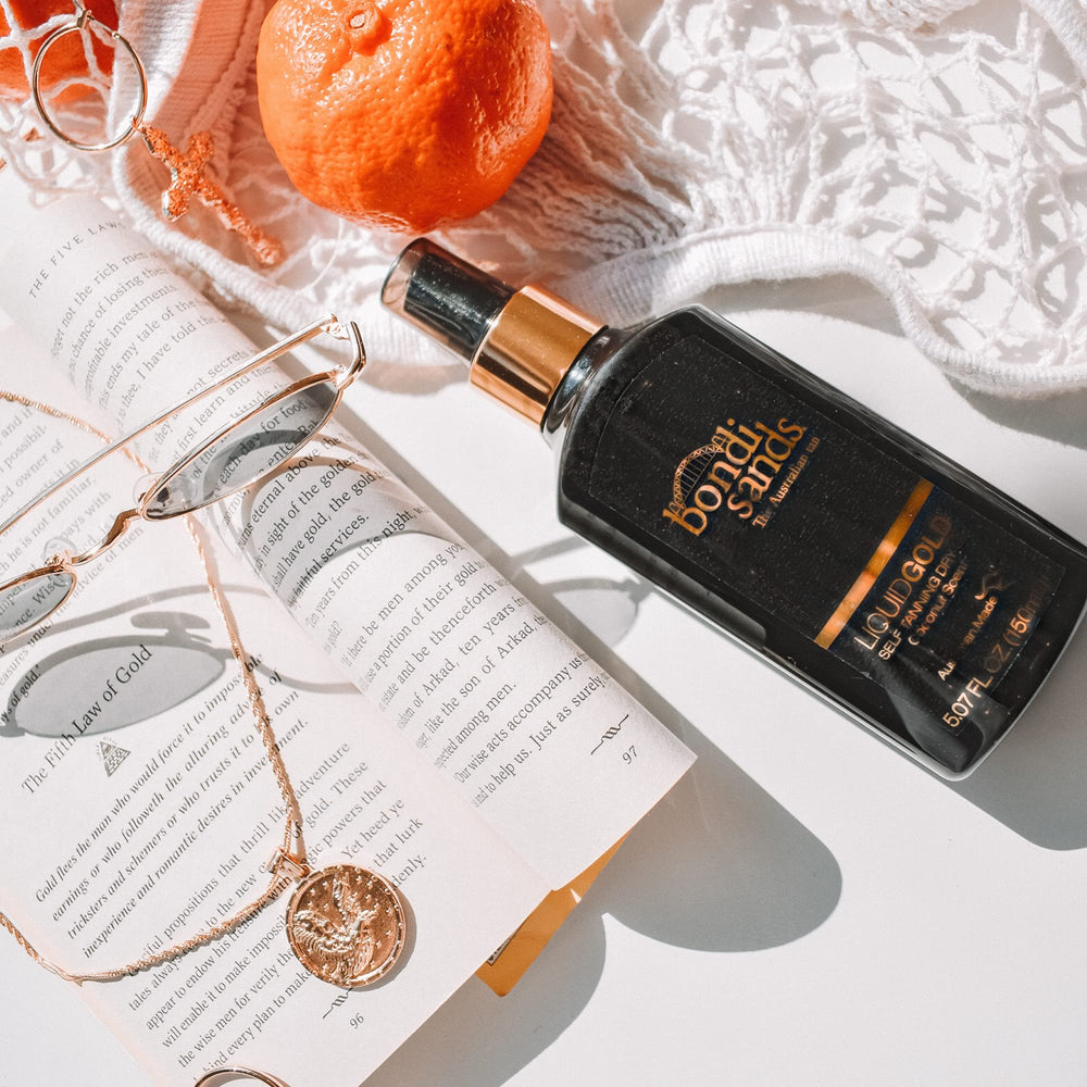Bondi Sands Liquid Gold tan development shows a soft, golden shade.