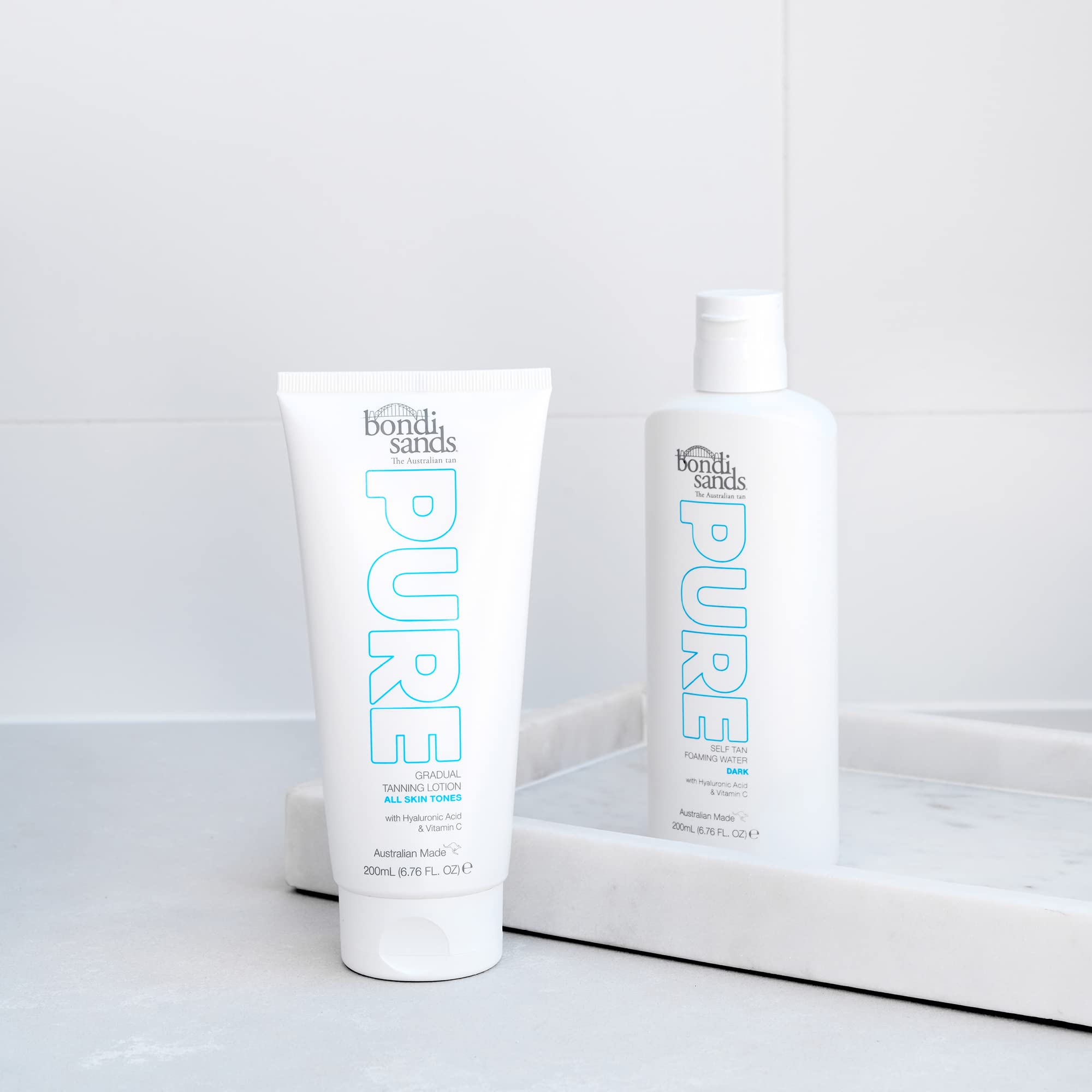 Bondi Sands PURE application shot highlights even streak-free application for a natural tan.
